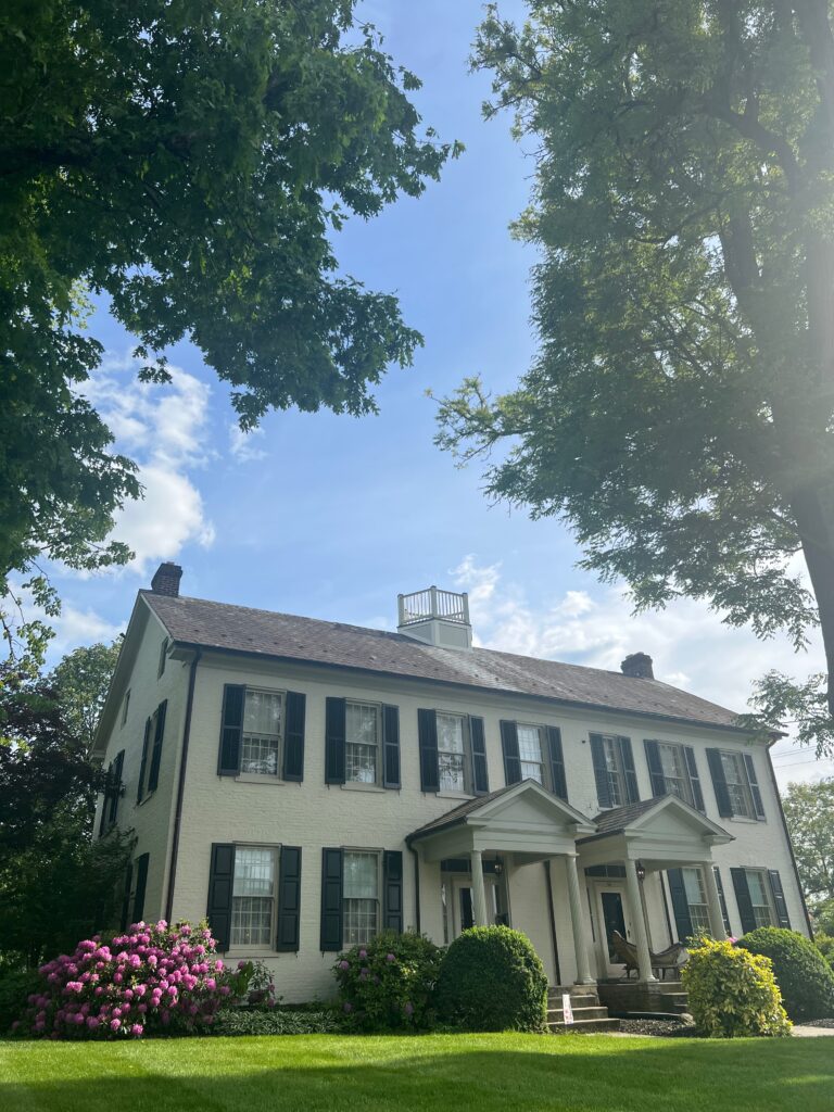 Gettysburg Academy Bed and Breakfast in historic downtown Gettysburg. Beautiful flowers bloom around the Gettysburg Academy building in spring. Large private lot, private parking for guests.